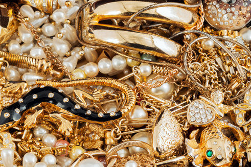 A pile of various gold jewelries ready to be inspected at our gold pawn shop in Massachusetts