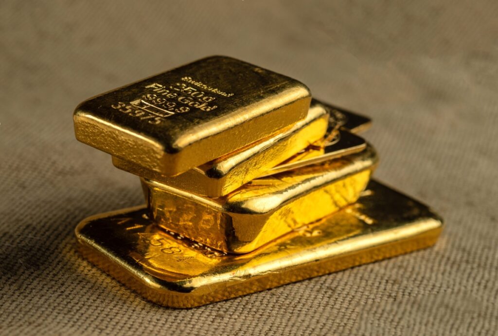 A stack of gold bars sitting on top of each other.