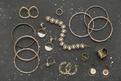Assortment of gold bracelets, rings, and earrings.